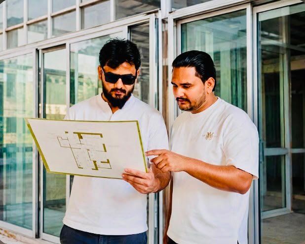 A R Aluminium and Glass team reviewing project plans at the Musaffah workshop in Abu Dhabi