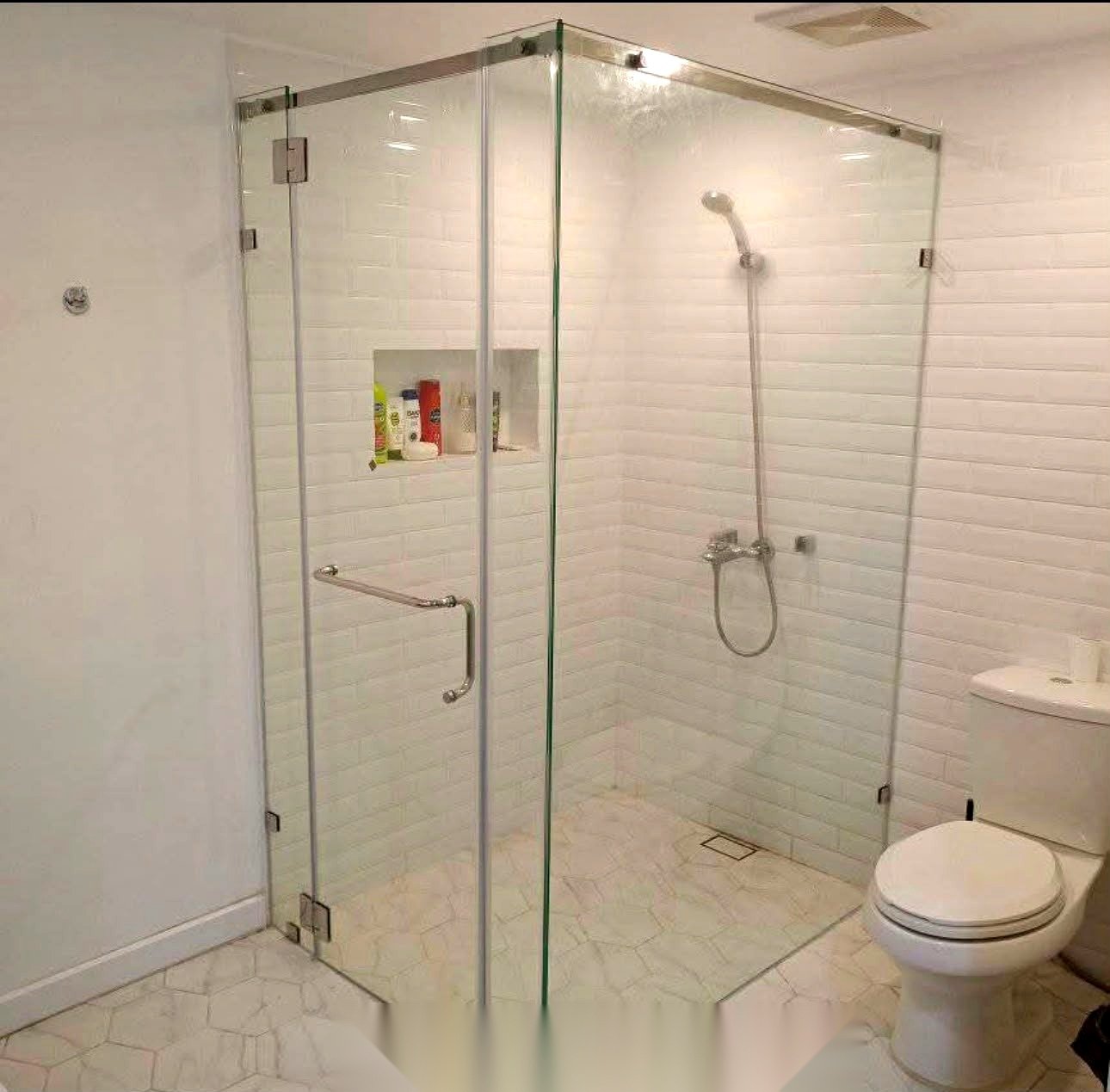 Frameless corner shower glass enclosure installation in Abu Dhabi