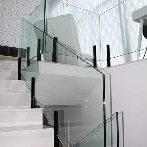 Frameless glass staircase railing installation by A R Aluminium and Glass in Abu Dhabi