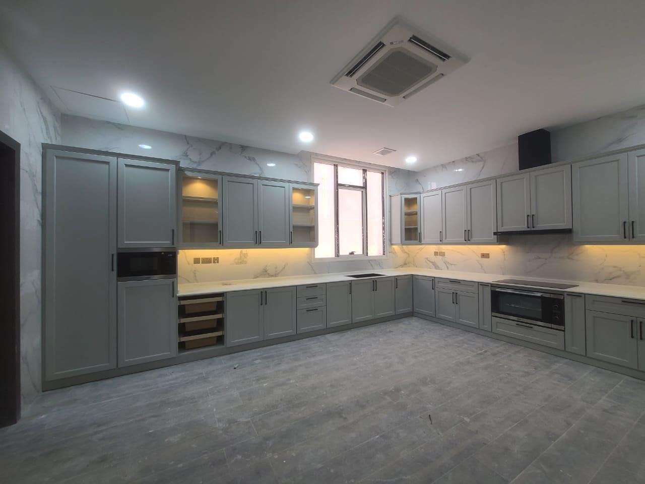 Grey aluminium kitchen cabinets, U-shape layout, installed by A R Aluminium and Glass in Abu Dhabi