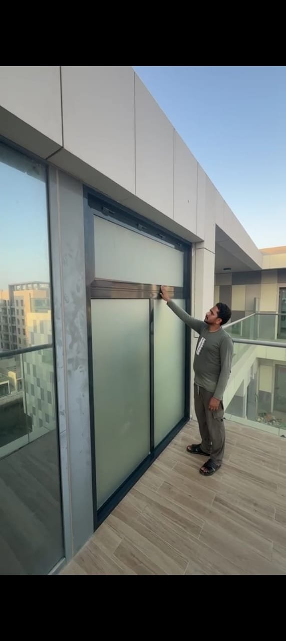 Frosted aluminium awning window giving privacy and ventilation to a villa bathroom in Abu Dhabi