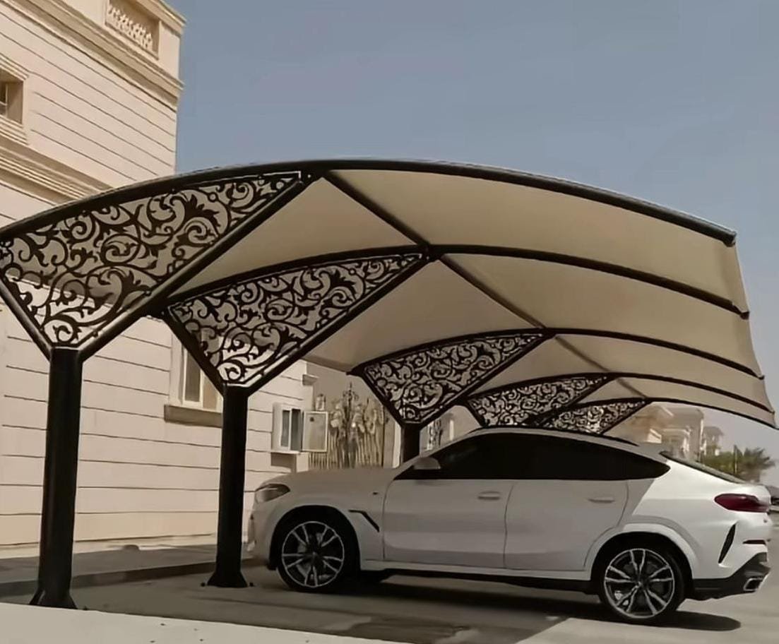 Laser-cut aluminium car parking shade over a BMW at a private villa in Abu Dhabi