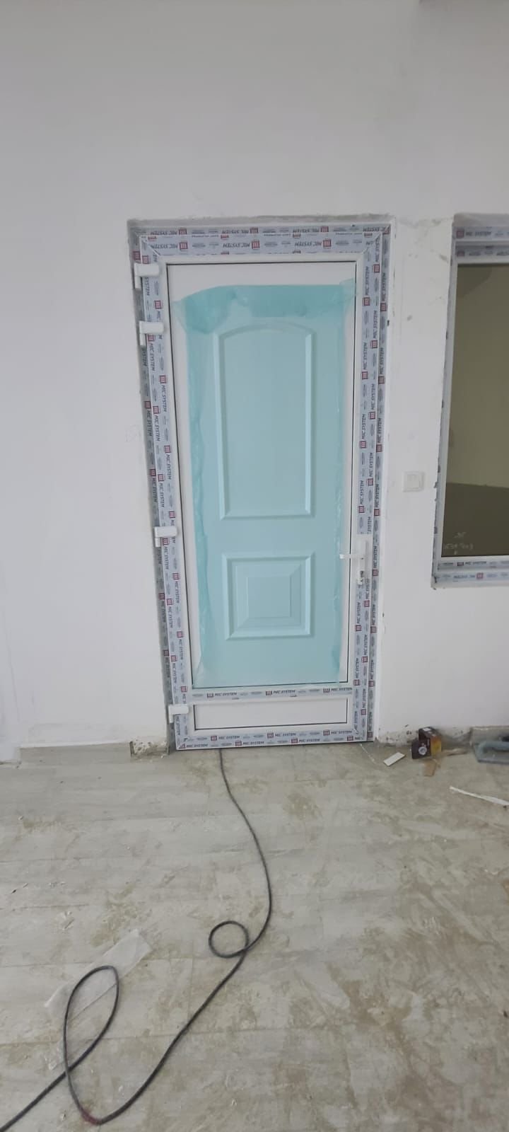 Premium white uPVC 5-panel arch door in a luxury villa interior in Abu Dhabi, supplied and fitted by A R Aluminium and Glass